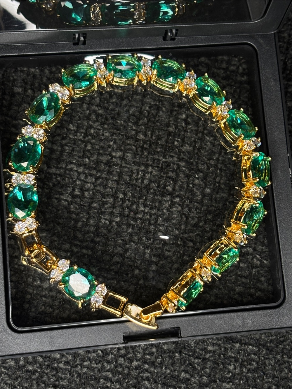 Gold Bracelet with Emerald Green Stones